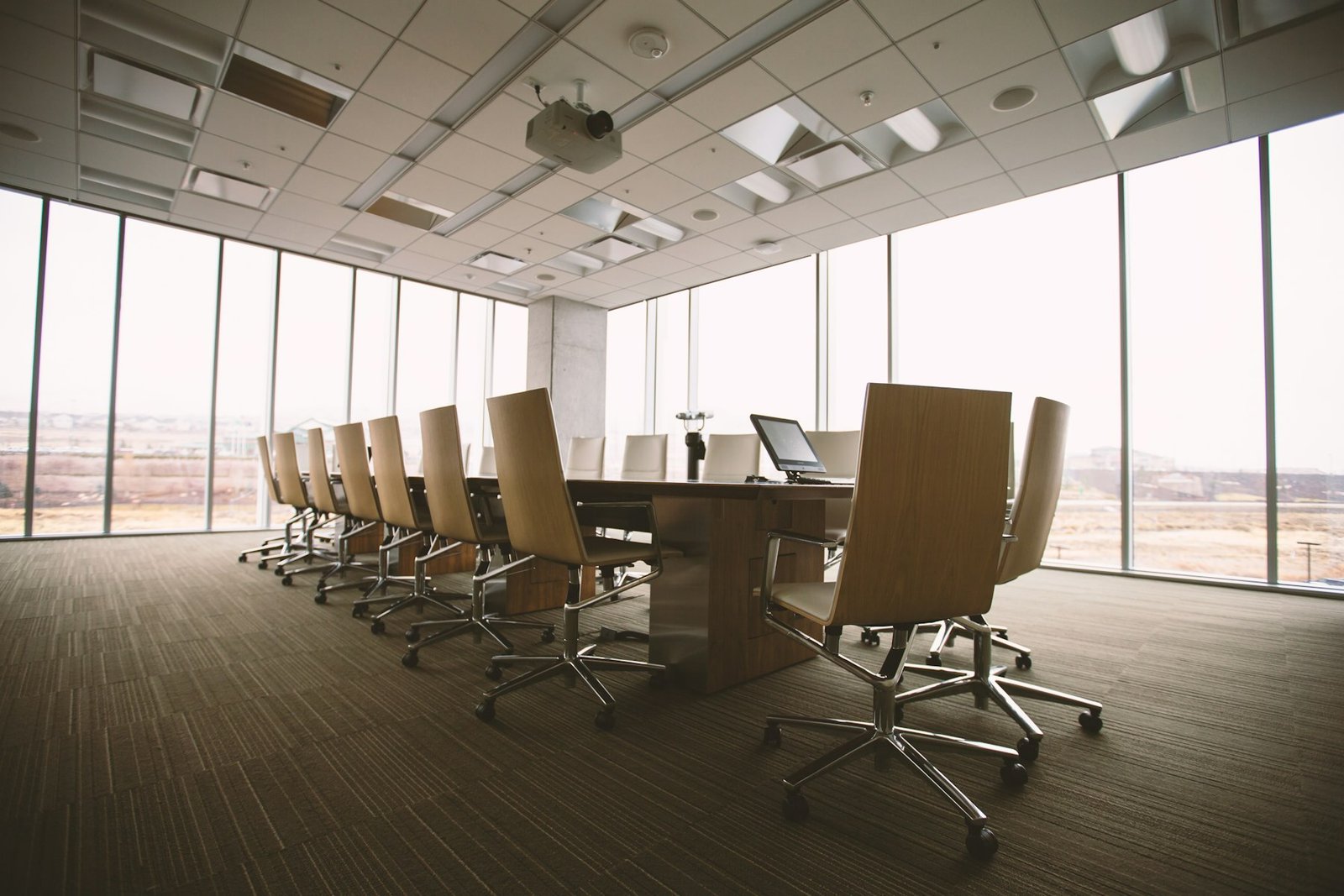 An empty boardroom with a long table